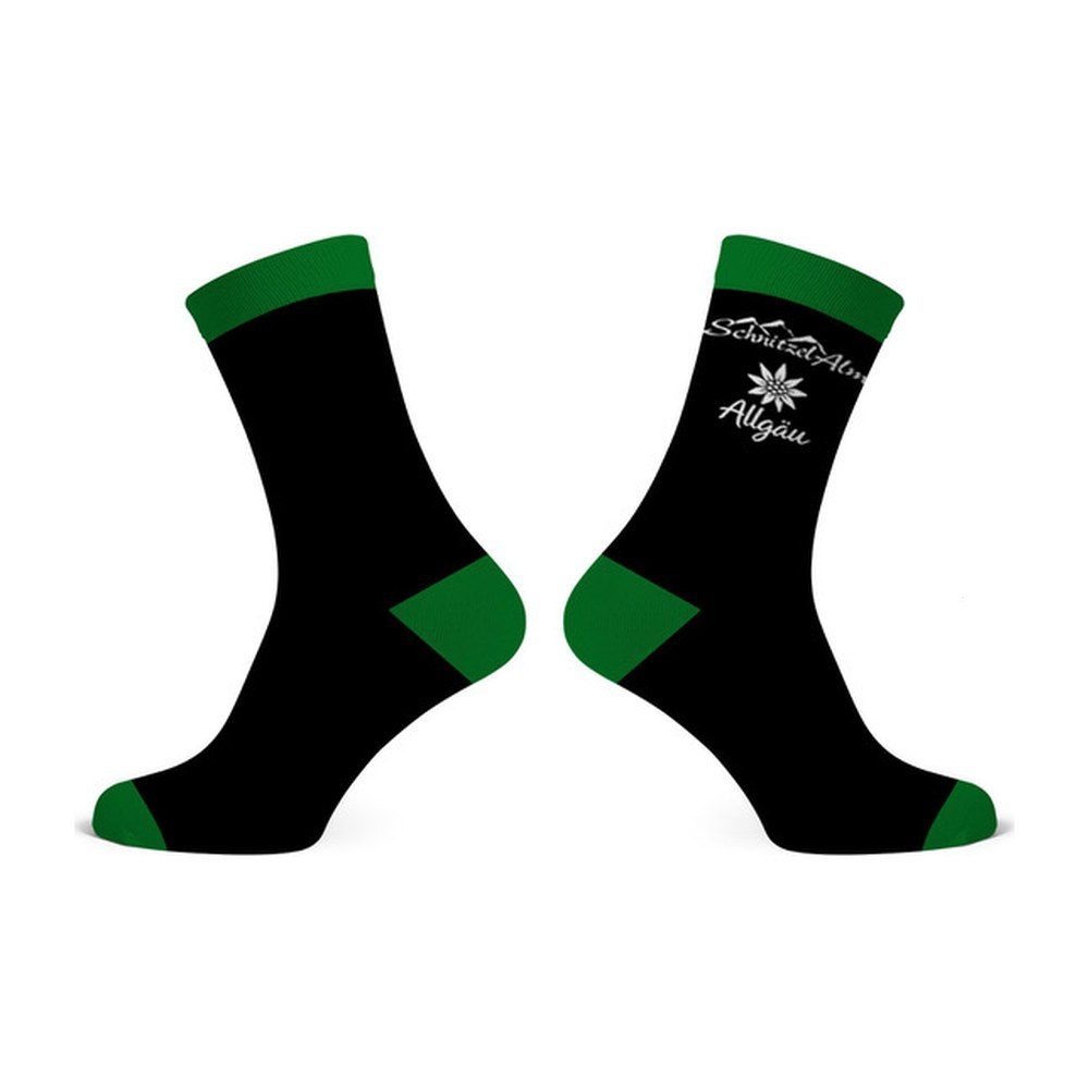 Schwarze Socken mit grünem Bund, grüner Ferse und Spitze, Edelweiß und Schriftzug „SchnitzelAlm Allgäu“